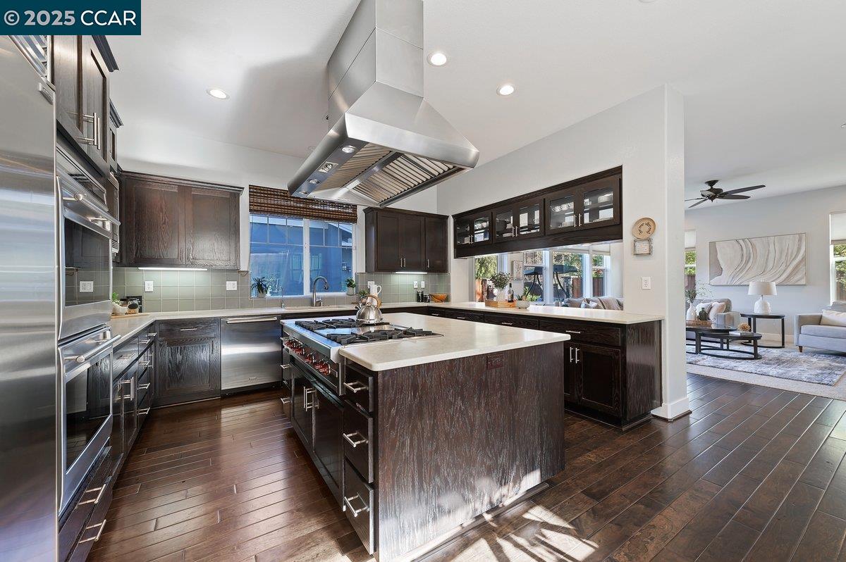 5656 Stockton Loop Livermore, CA 94550 - Photo 15 of 37 a kitchen with stainless steel appliances granite countertop a stove and a refrigerator
