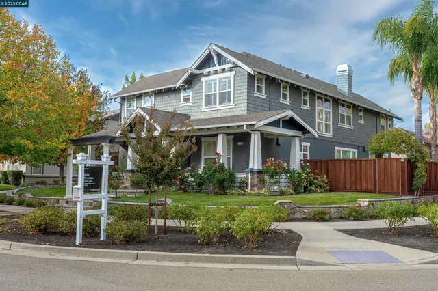 a bedroom with a bed lamp closet and window