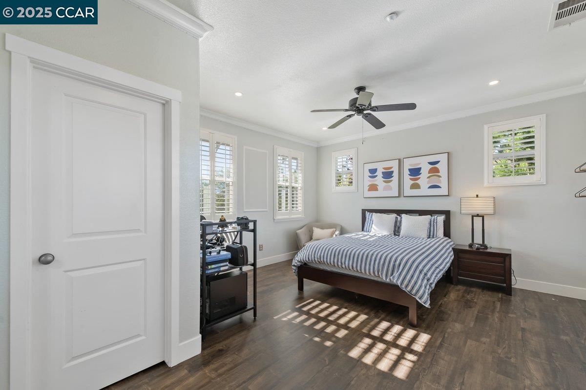 5656 Stockton Loop Livermore, CA 94550 - Photo 26 of 37 a living room with a bed furniture and a window