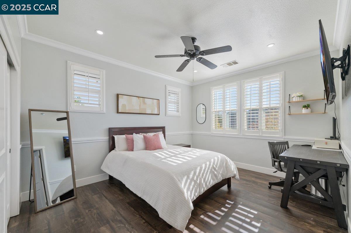 5656 Stockton Loop Livermore, CA 94550 - Photo 28 of 37 a bedroom with a bed a table and chair