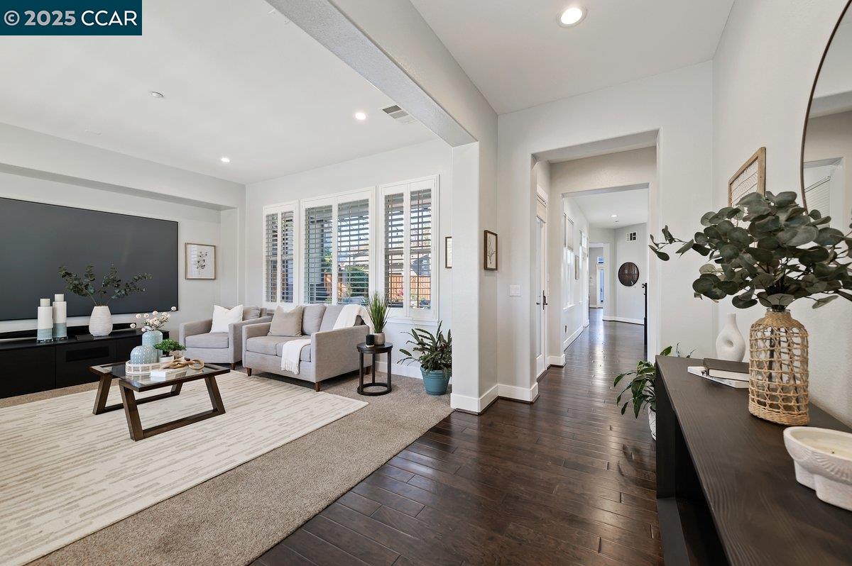5656 Stockton Loop Livermore, CA 94550 - Photo 4 of 37 a living room with furniture and a potted plant