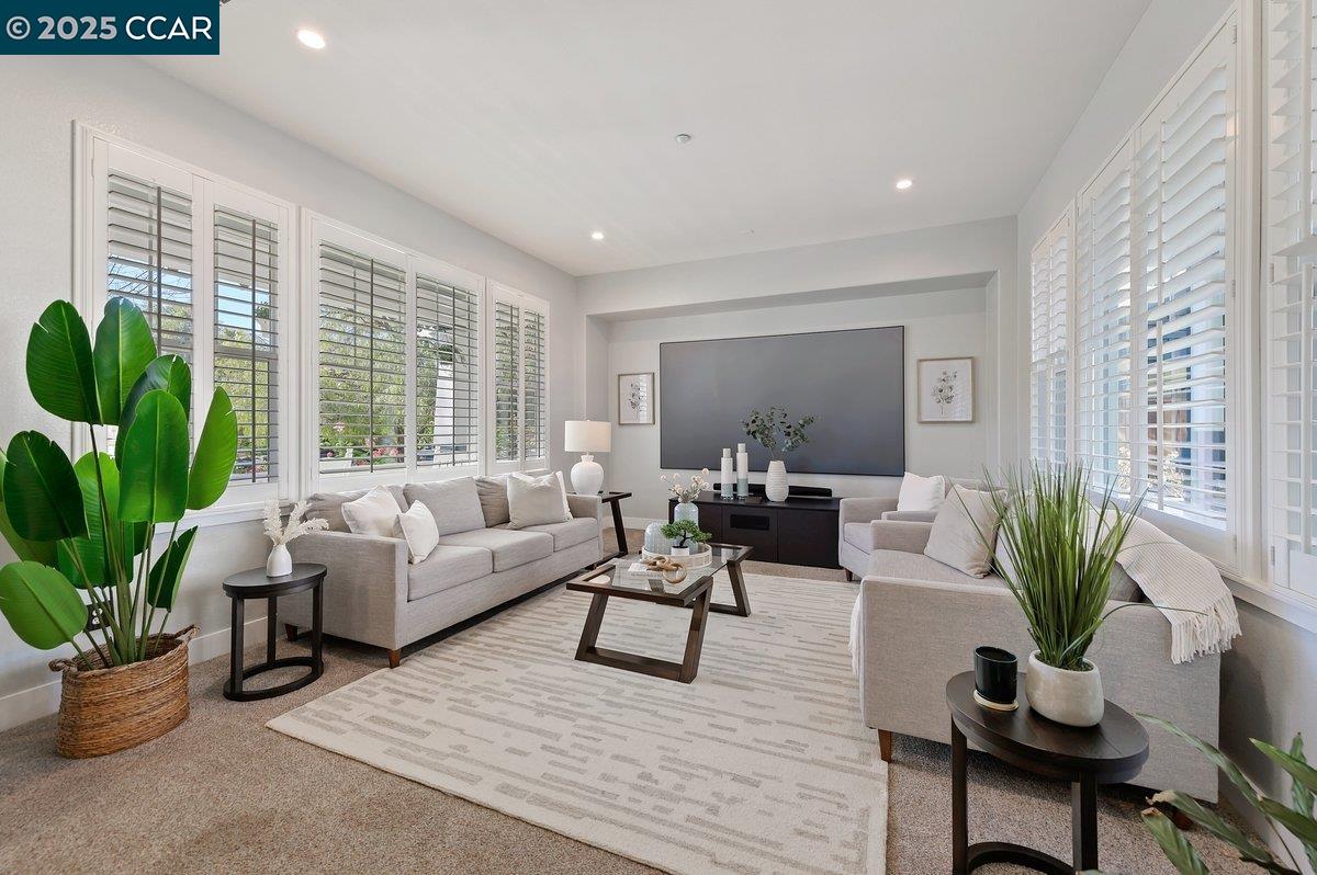 5656 Stockton Loop Livermore, CA 94550 - Photo 6 of 37 a living room with furniture potted plant and windows