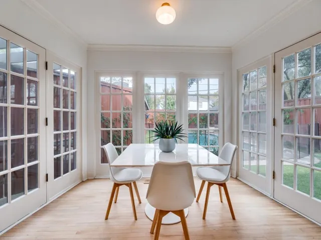 a view of a dining room with furniture window and wooden floor