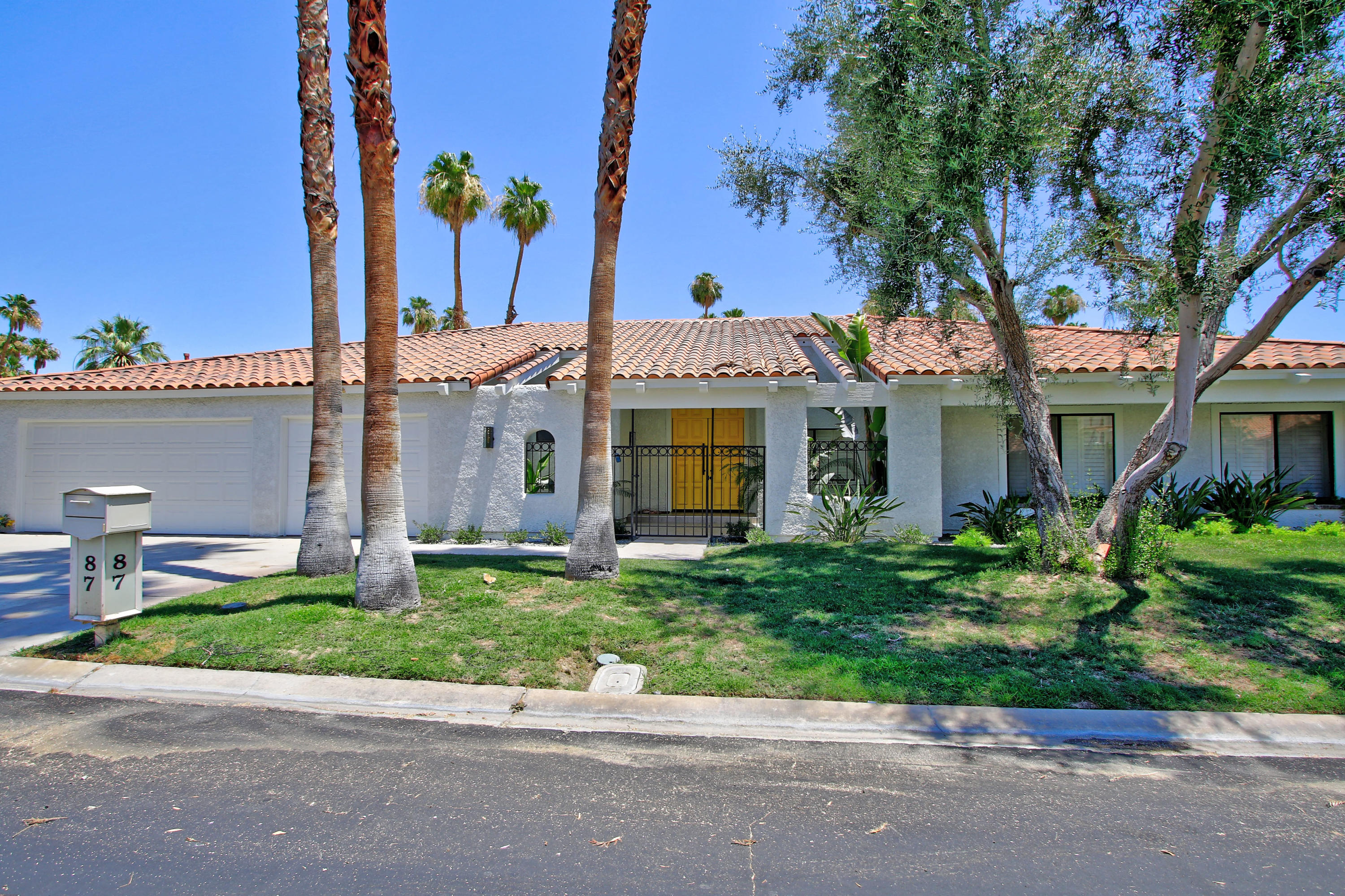87 Magdalena Drive Rancho Mirage, CA 92270 - Photo 1 of 64 front view of a house with a garden