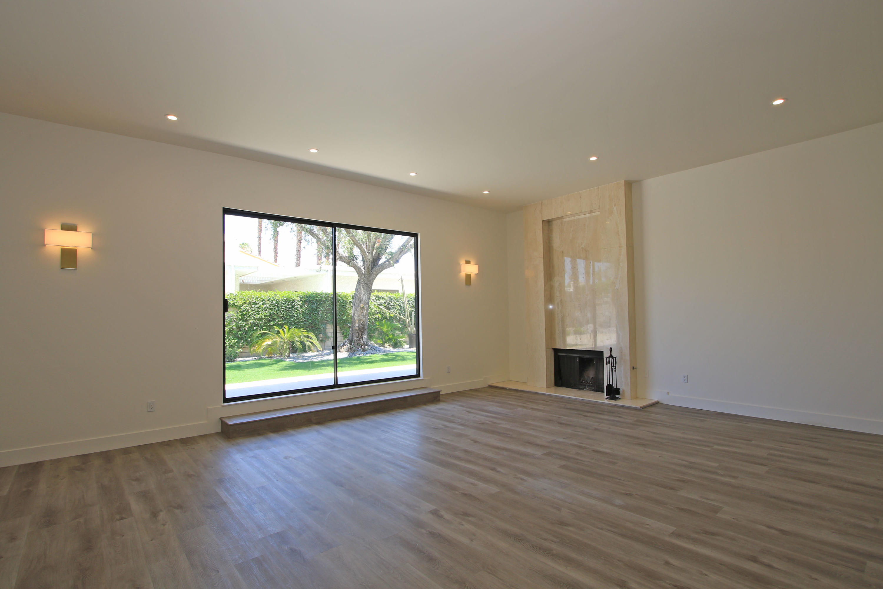 87 Magdalena Drive Rancho Mirage, CA 92270 - Photo 11 of 64 an empty room with wooden floor and windows