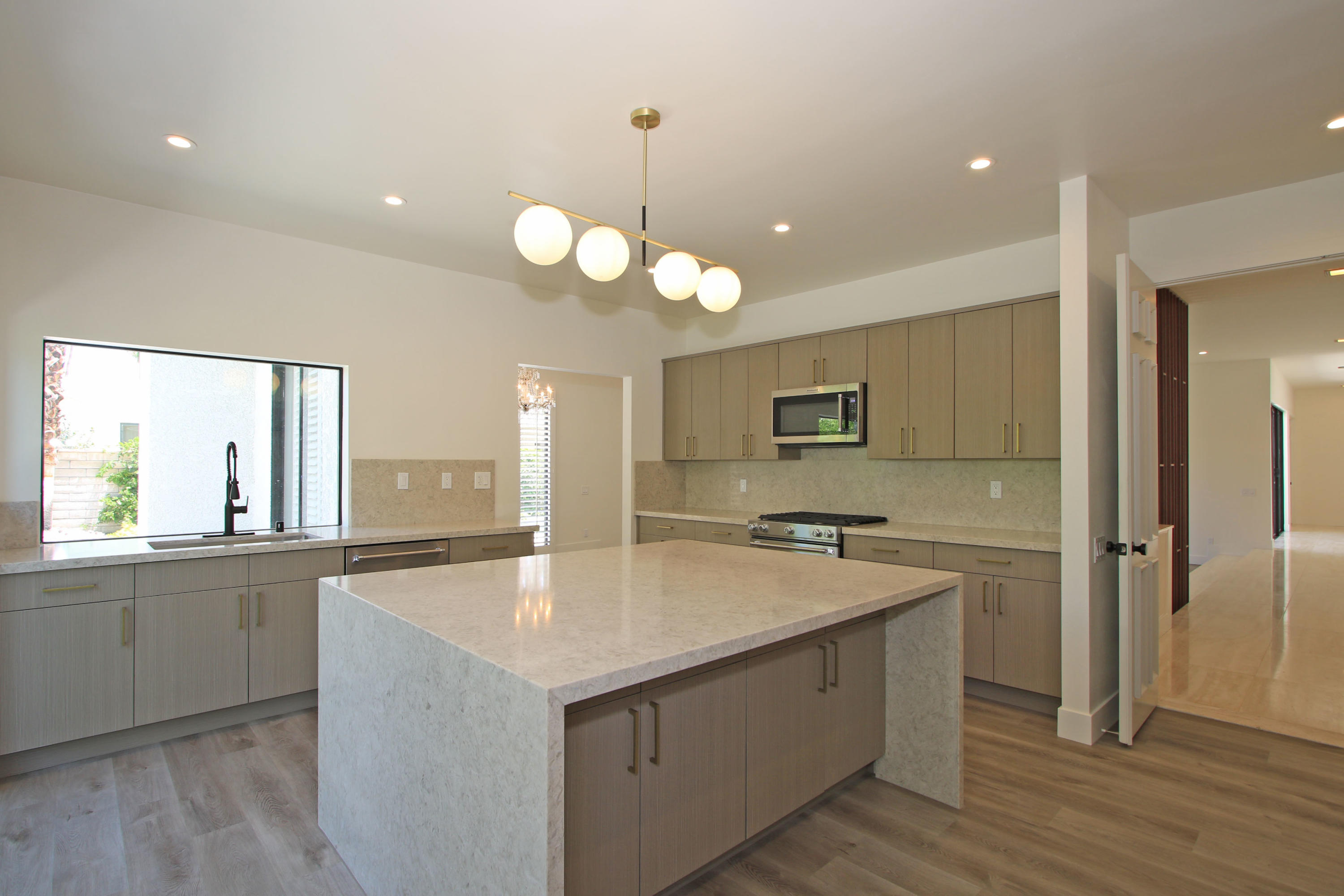 87 Magdalena Drive Rancho Mirage, CA 92270 - Photo 16 of 64 a large kitchen with stainless steel appliances granite countertop a sink and dishwasher