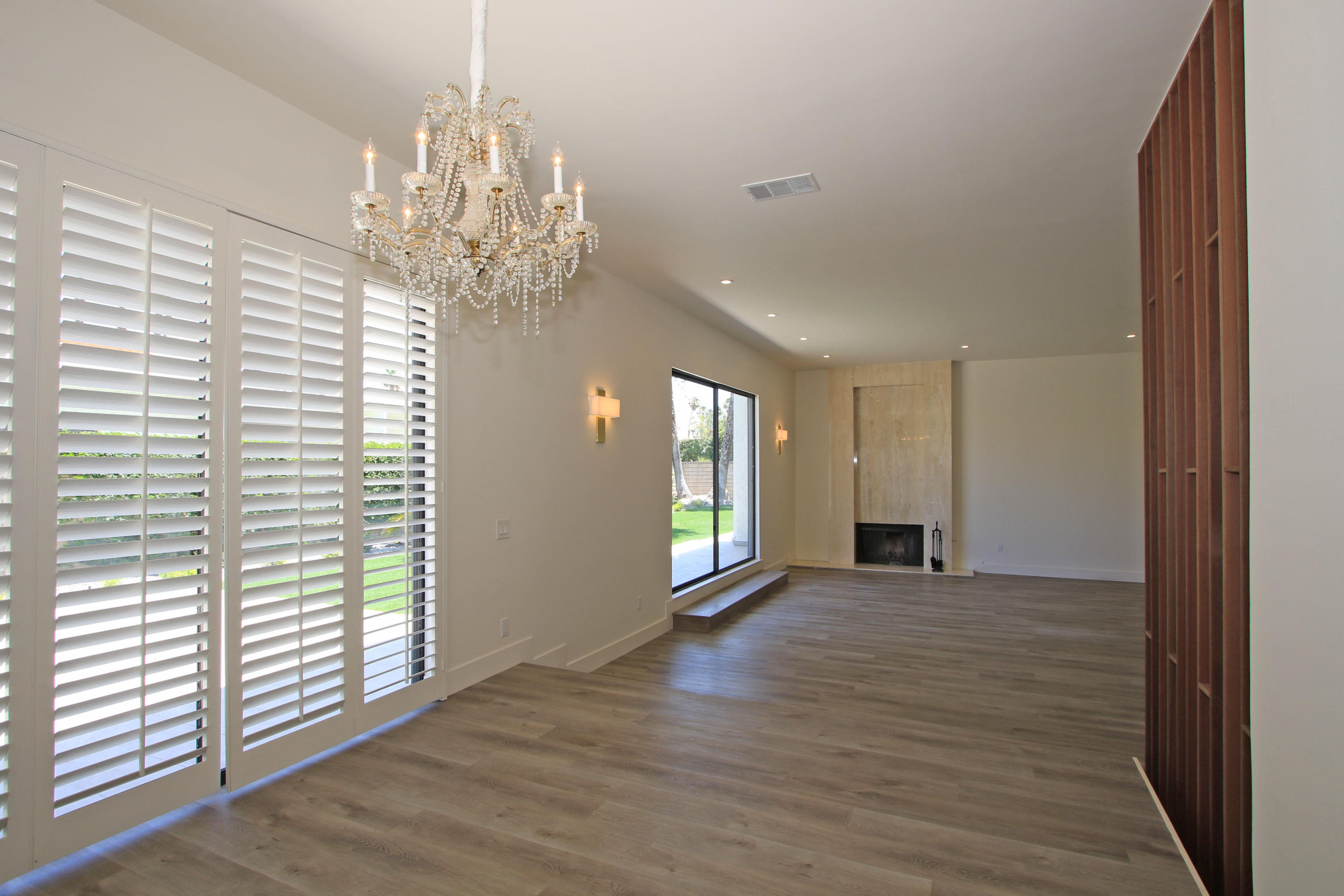 87 Magdalena Drive Rancho Mirage, CA 92270 - Photo 20 of 64 a view of an empty room with window and wooden floor