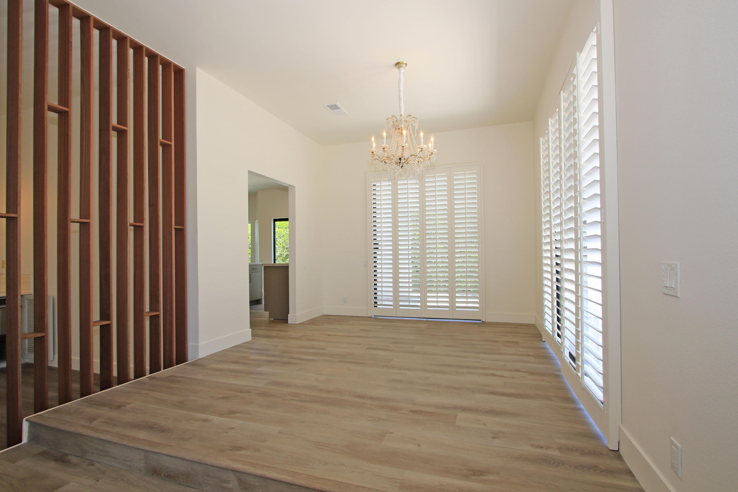 87 Magdalena Drive Rancho Mirage, CA 92270 - Photo 22 of 64 a view of an empty room with wooden floor and a window