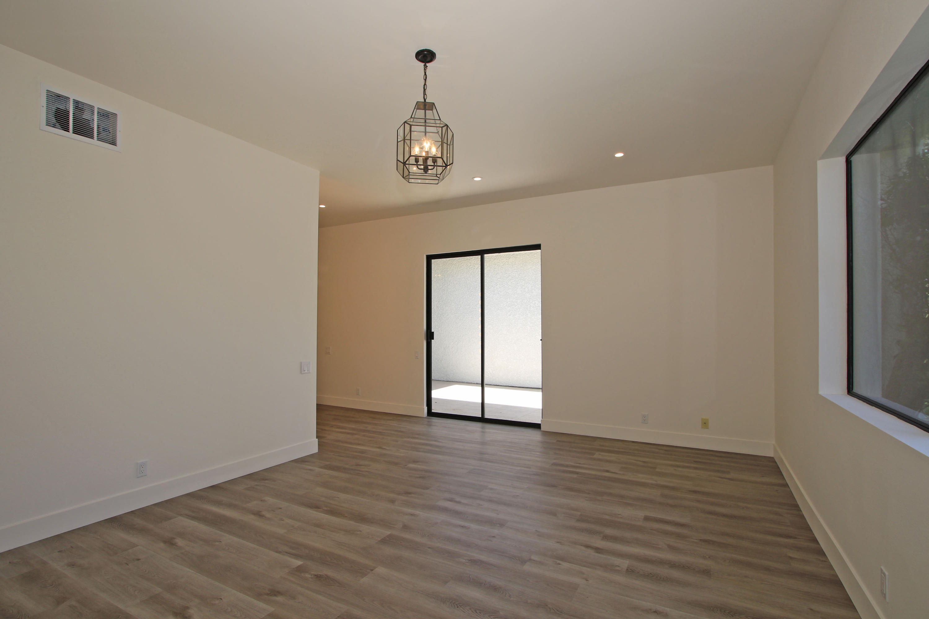 87 Magdalena Drive Rancho Mirage, CA 92270 - Photo 28 of 64 wooden floor in an empty room with a window