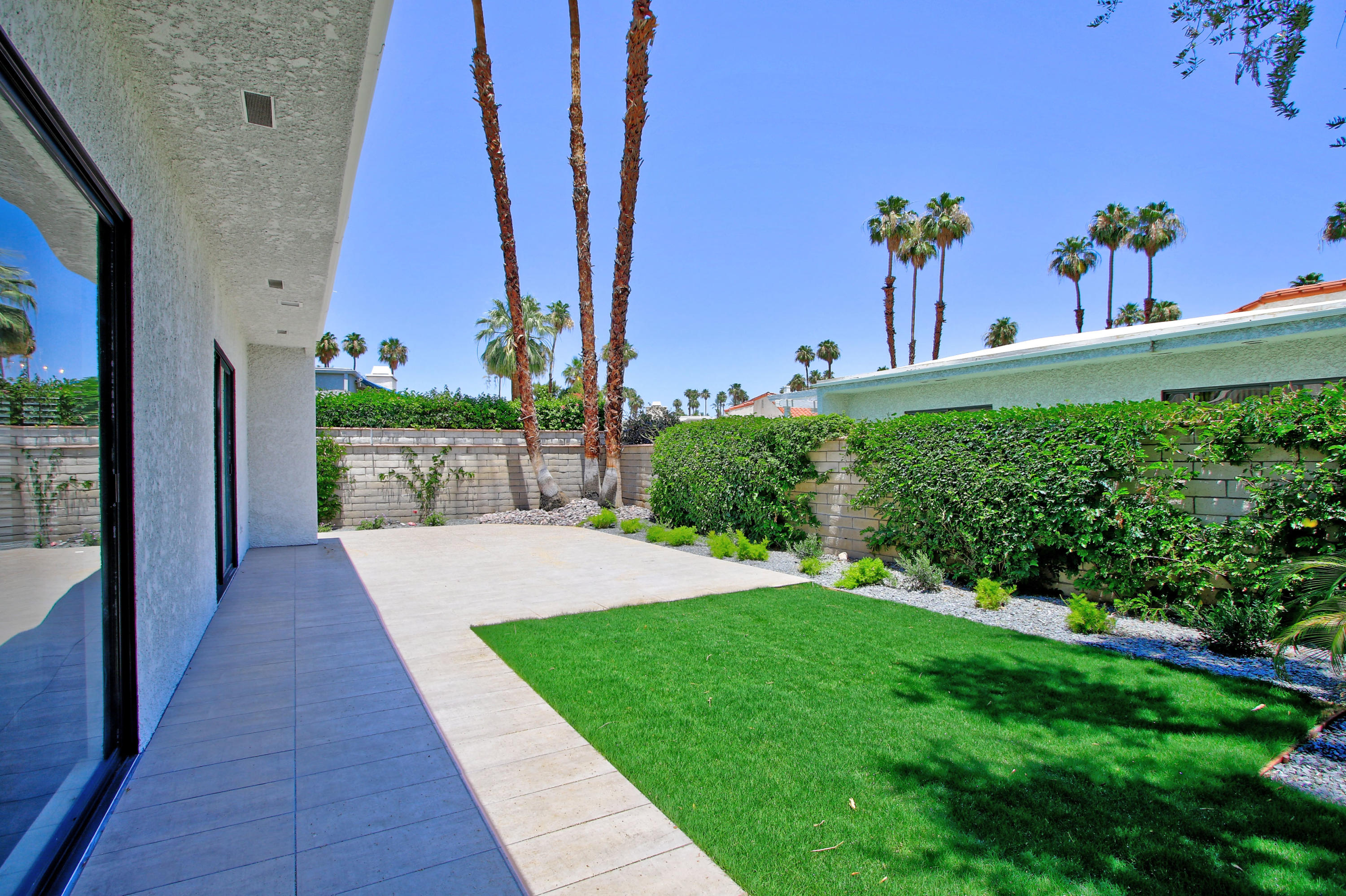 87 Magdalena Drive Rancho Mirage, CA 92270 - Photo 4 of 64 a view of a yard with an outdoor space