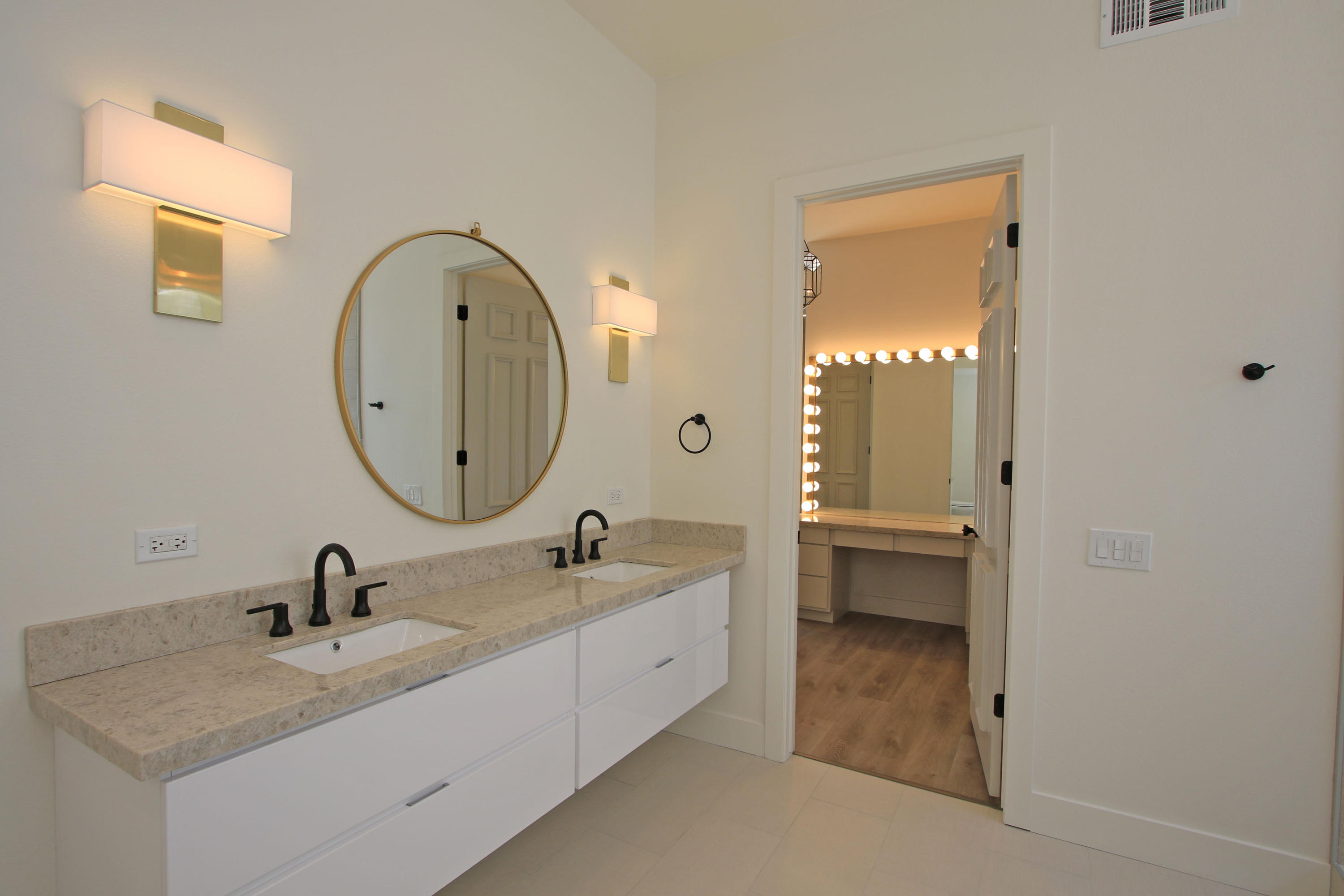 87 Magdalena Drive Rancho Mirage, CA 92270 - Photo 34 of 64 a bathroom with a sink double vanity and a mirror
