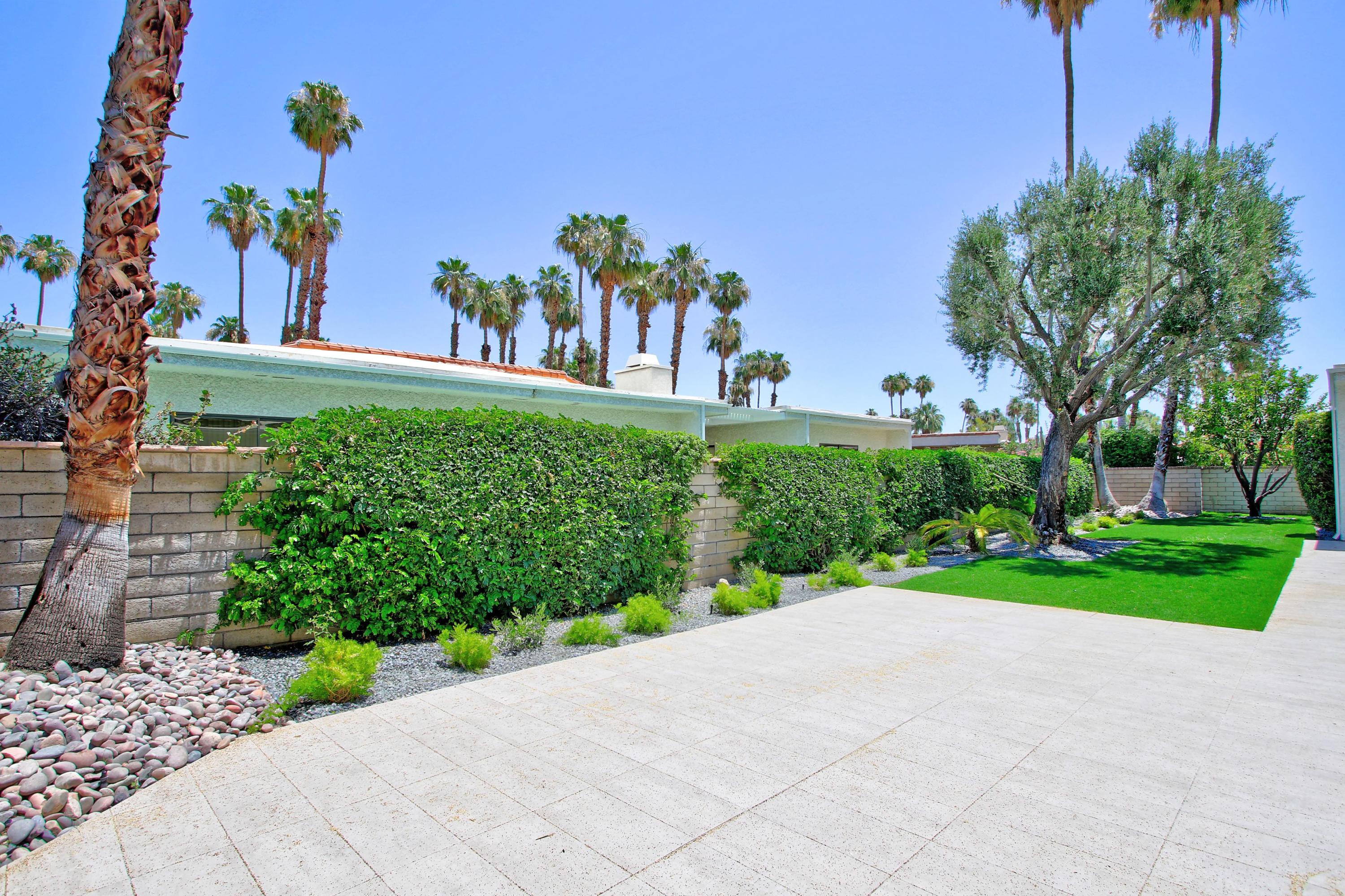 87 Magdalena Drive Rancho Mirage, CA 92270 - Photo 43 of 64 a view of a park with a tree in the background