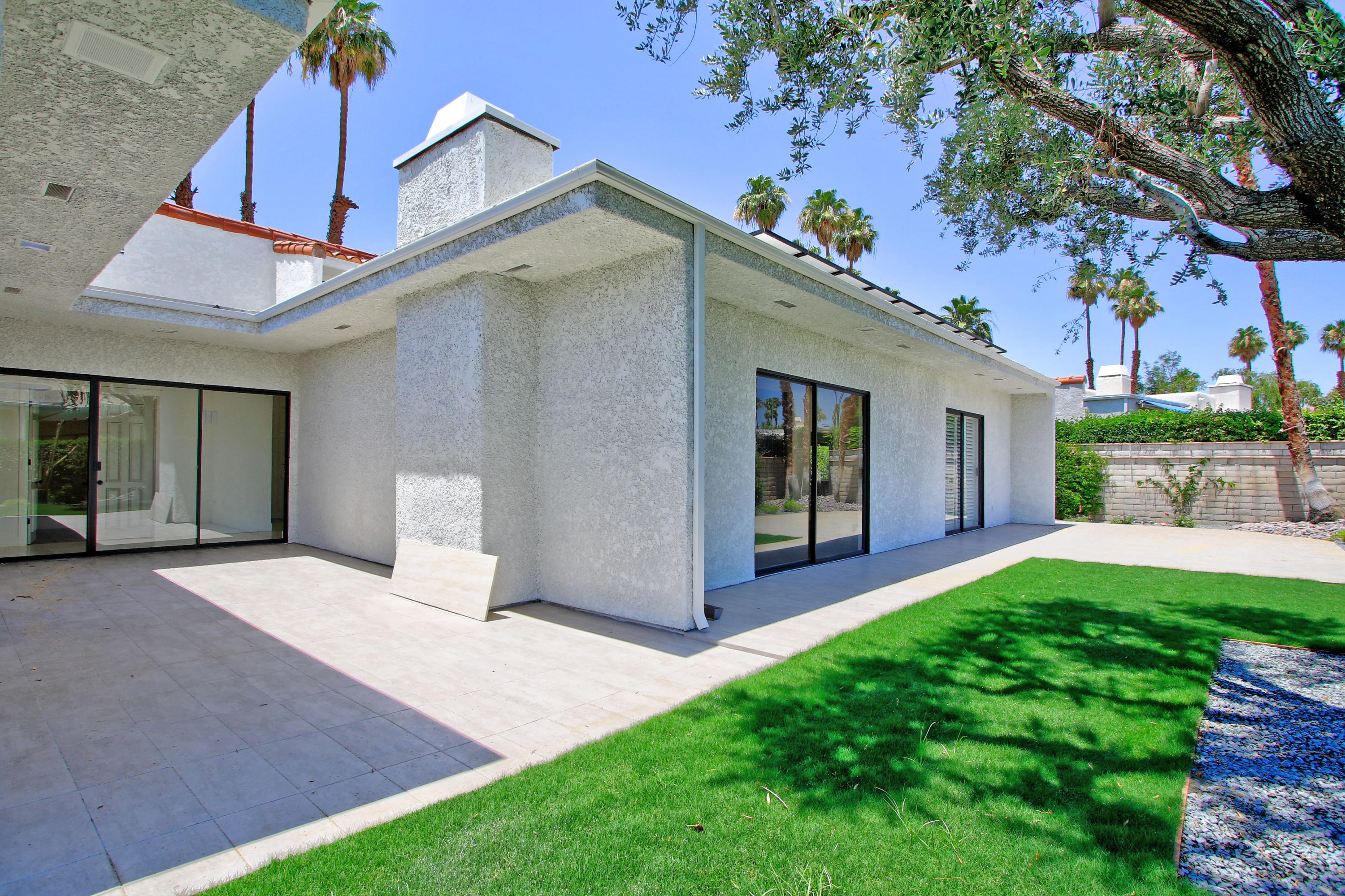 87 Magdalena Drive Rancho Mirage, CA 92270 - Photo 46 of 64 a view of a house with a yard and small tree