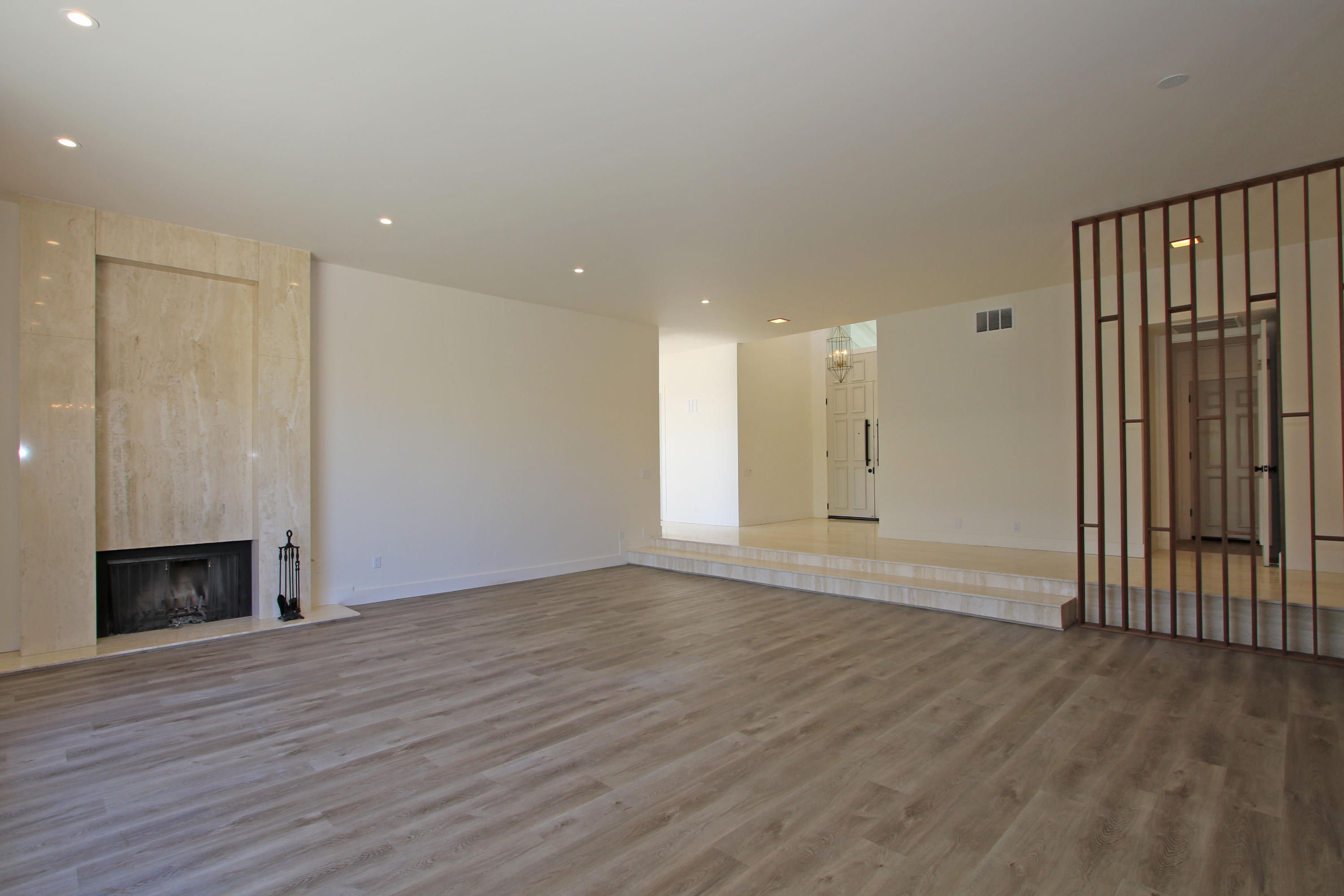 87 Magdalena Drive Rancho Mirage, CA 92270 - Photo 6 of 64 an empty room with wooden floor and windows