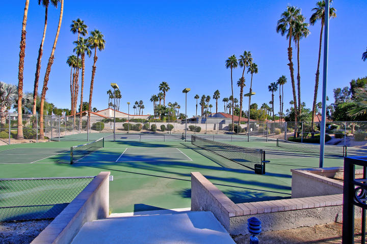 87 Magdalena Drive Rancho Mirage, CA 92270 - Photo 55 of 64 a view of a yard with furniture and palm tree