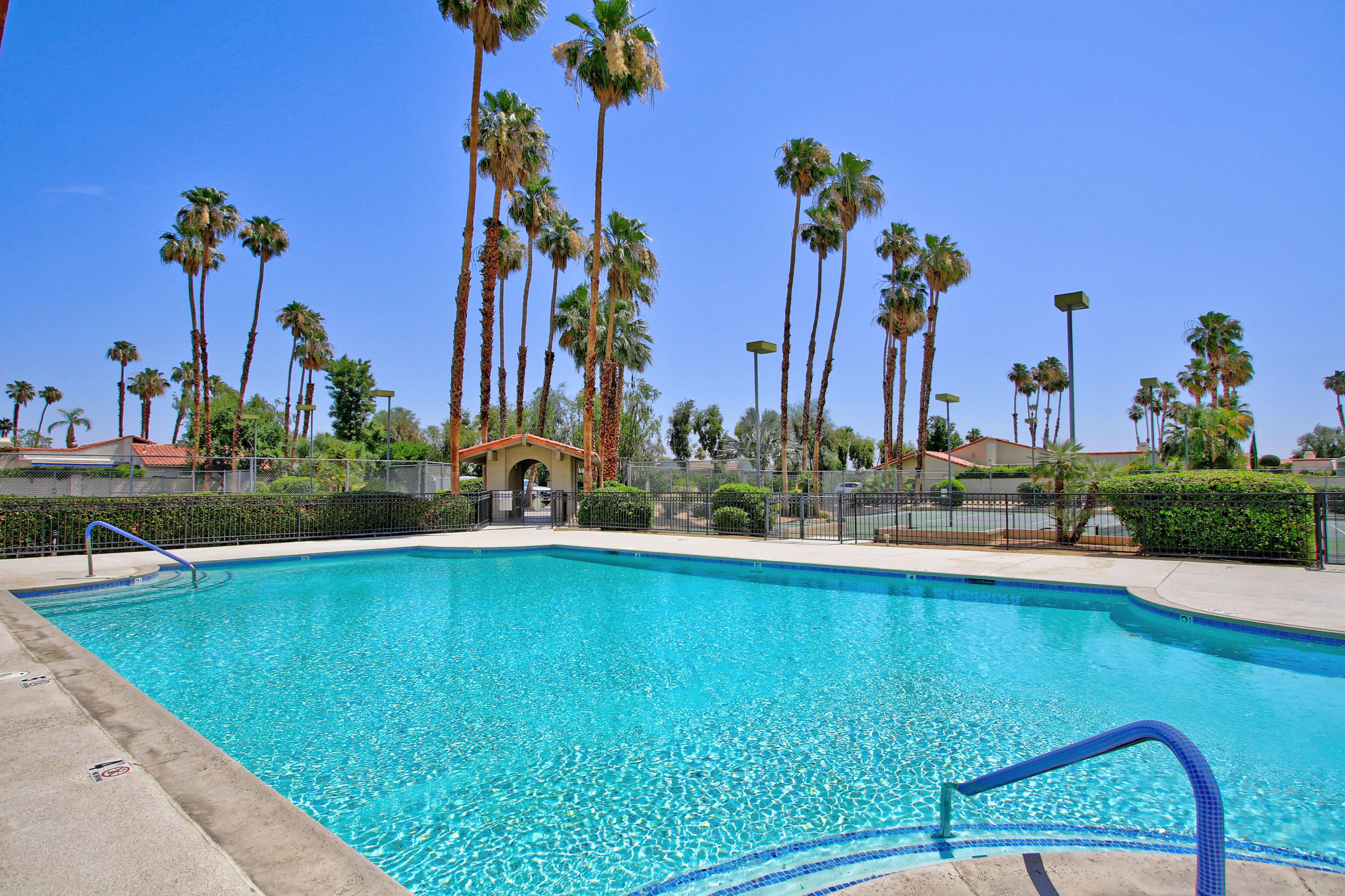 87 Magdalena Drive Rancho Mirage, CA 92270 - Photo 59 of 64 a view of a swimming pool and a lounge chair