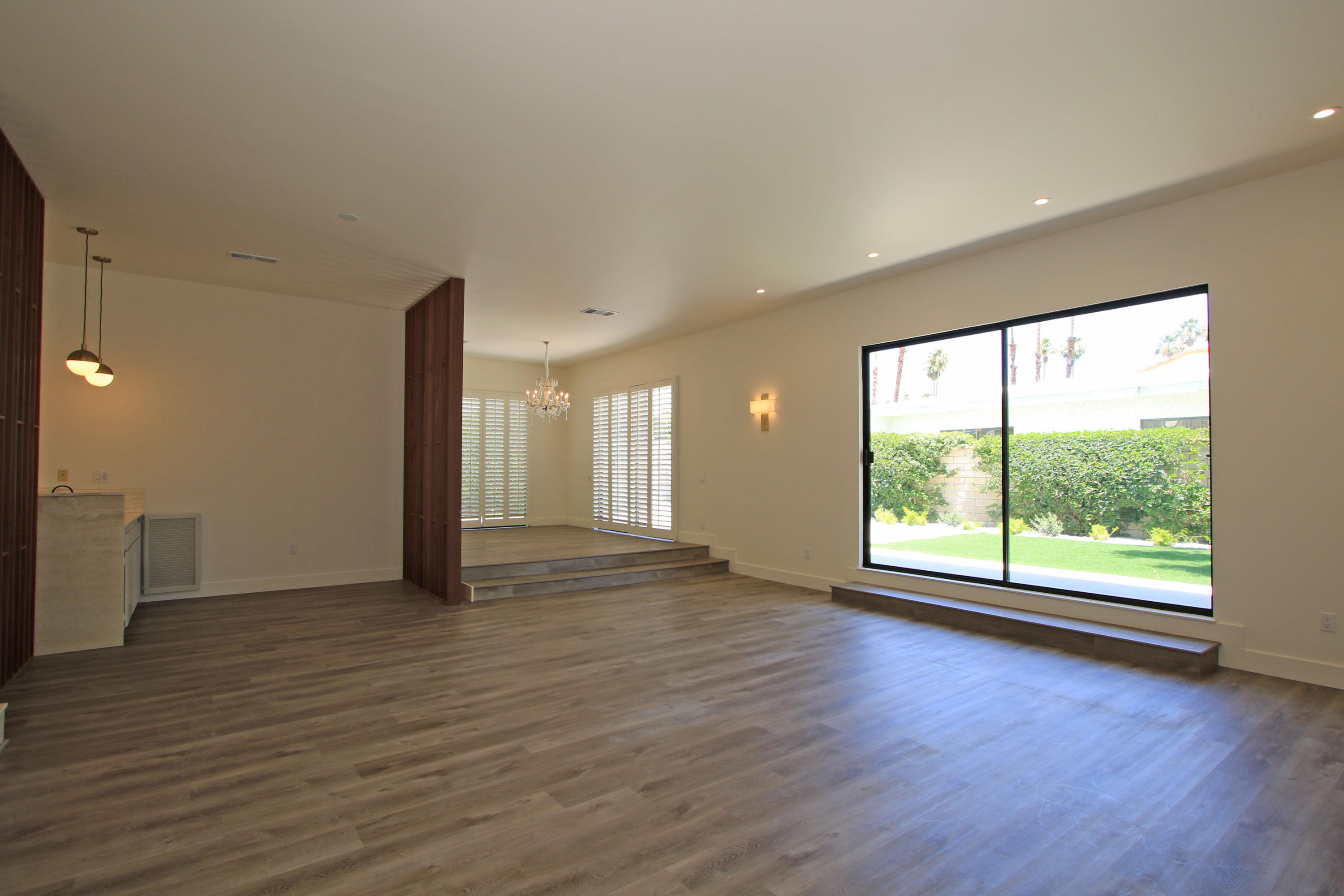 87 Magdalena Drive Rancho Mirage, CA 92270 - Photo 8 of 64 a view of an empty room with wooden floor and a window