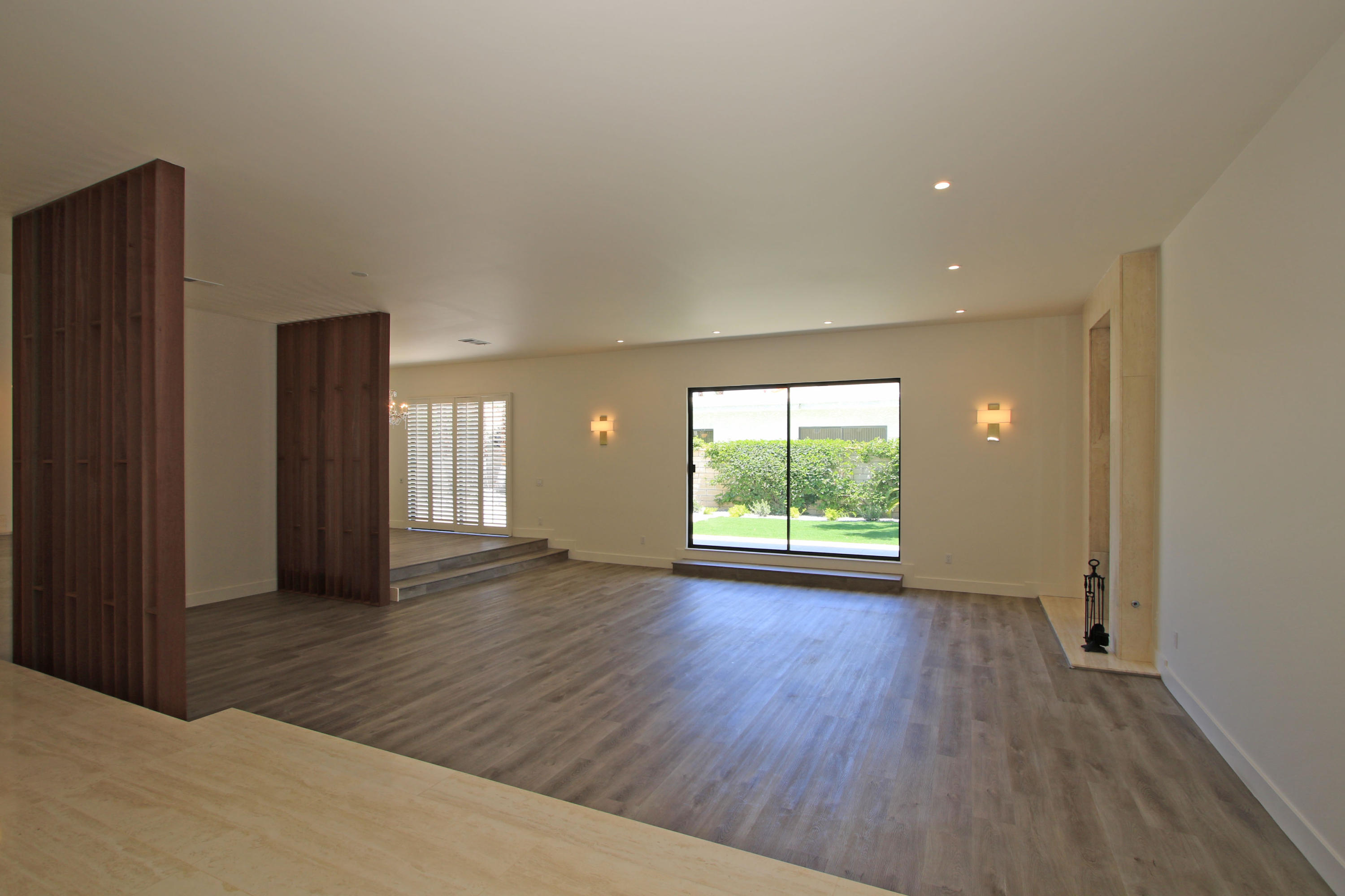 87 Magdalena Drive Rancho Mirage, CA 92270 - Photo 9 of 64 an empty room with wooden floor and windows