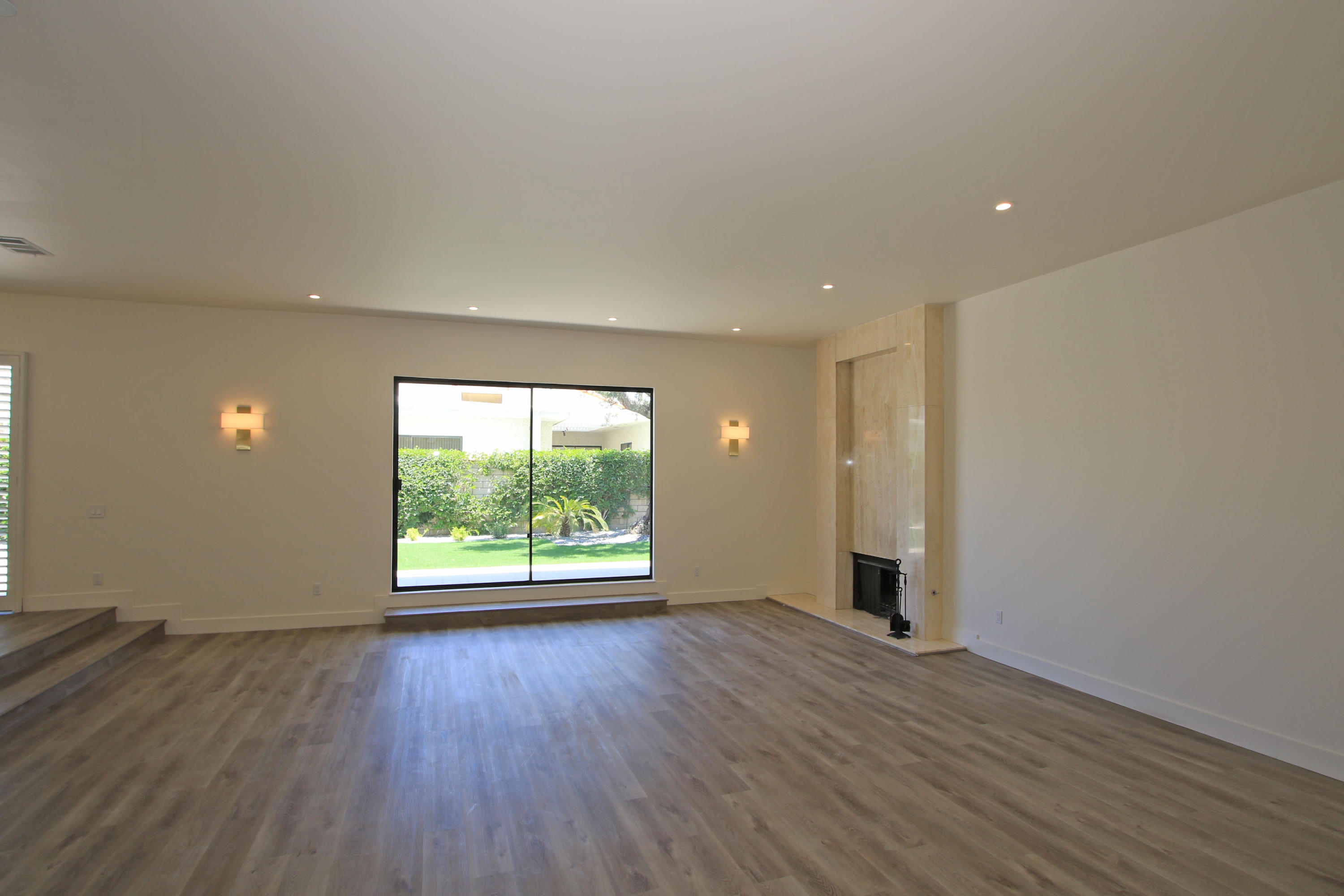 87 Magdalena Drive Rancho Mirage, CA 92270 - Photo 10 of 64 an empty room with wooden floor and windows