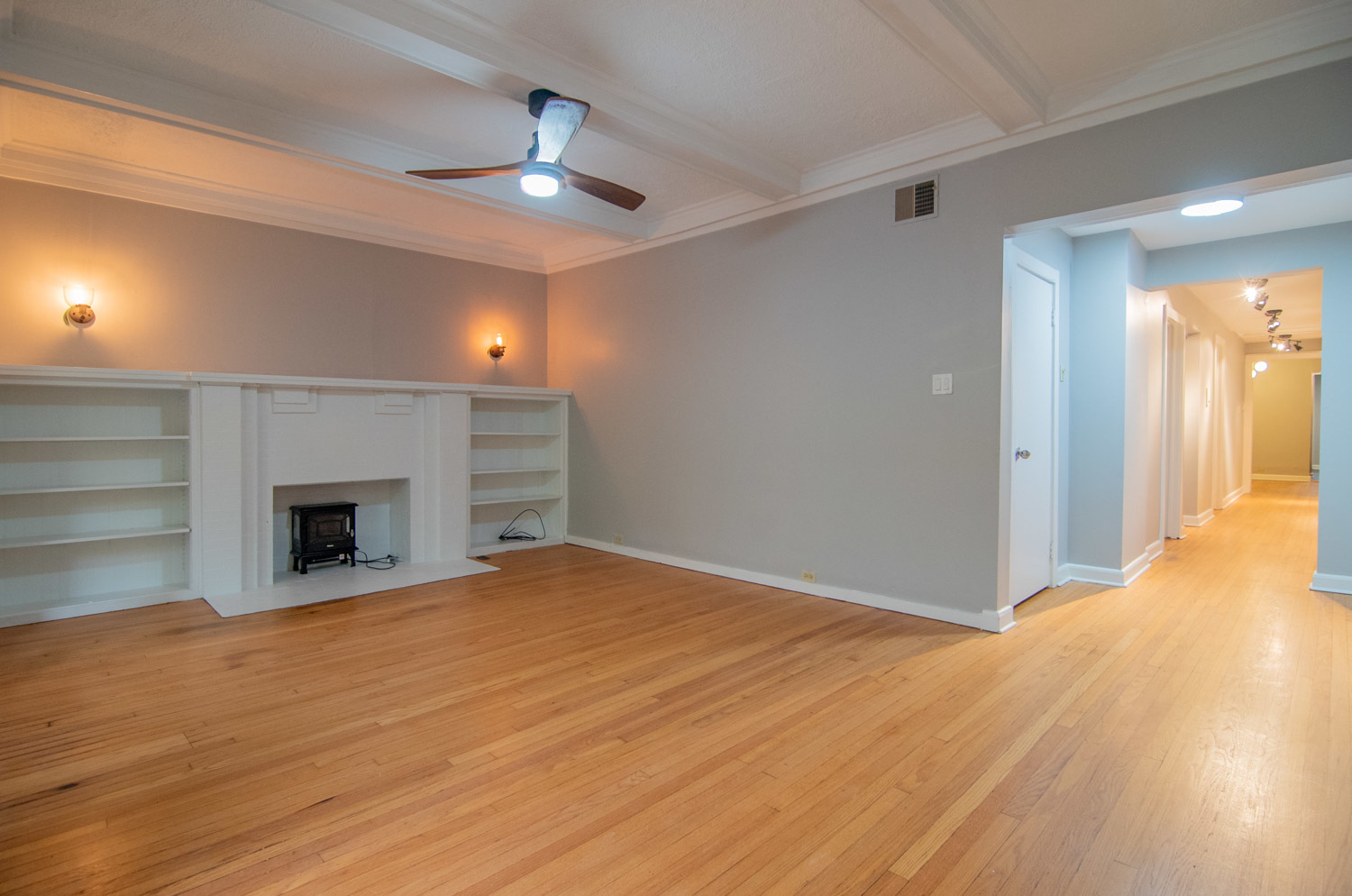 844 West Lakeside Place, Unit 1W Chicago, IL 60640 - Photo 3 of 14 a view of an empty room with a fireplace and a window