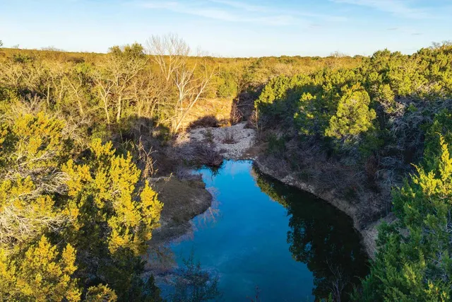 a view of a backyard of a house with a yard