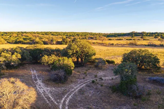 a view of a lake with houses in the back