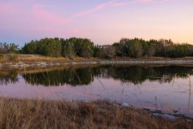a view of outdoor space with a lake view