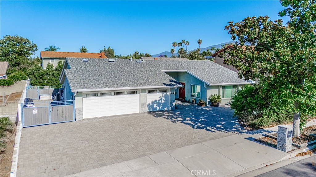 1817 Balboa Way Upland, CA 91784 - Photo 1 of 64 an aerial view of a house with yard and garage