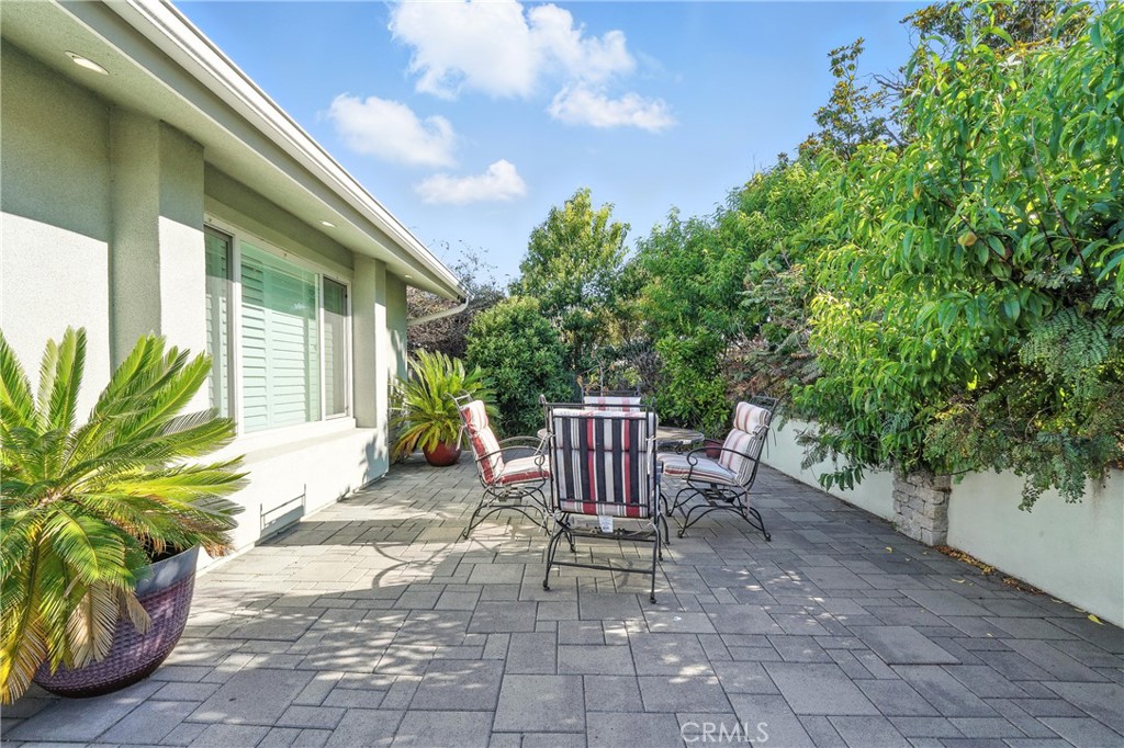 1817 Balboa Way Upland, CA 91784 - Photo 11 of 64 a view of a patio with table and chairs and potted plants