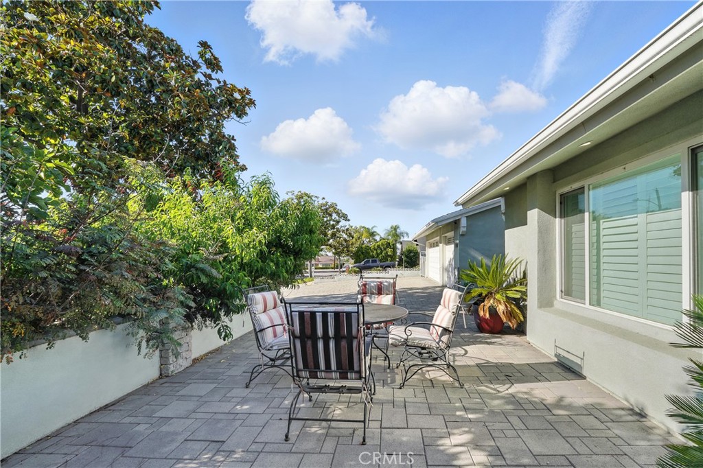 1817 Balboa Way Upland, CA 91784 - Photo 13 of 64 a view of a patio with a dining table and chairs with wooden fence
