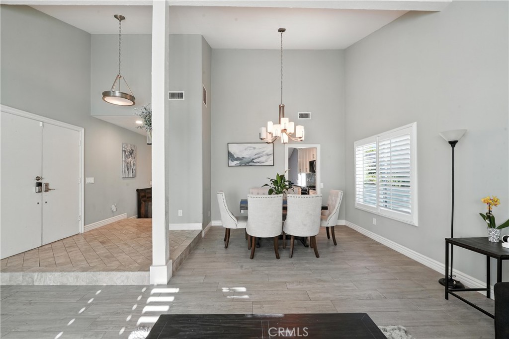 1817 Balboa Way Upland, CA 91784 - Photo 16 of 64 a view of a dining room with furniture window and wooden floor