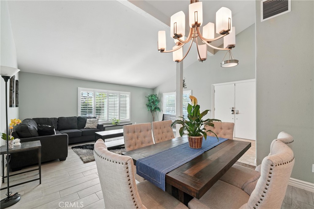1817 Balboa Way Upland, CA 91784 - Photo 17 of 64 a living room with furniture chandelier and a window