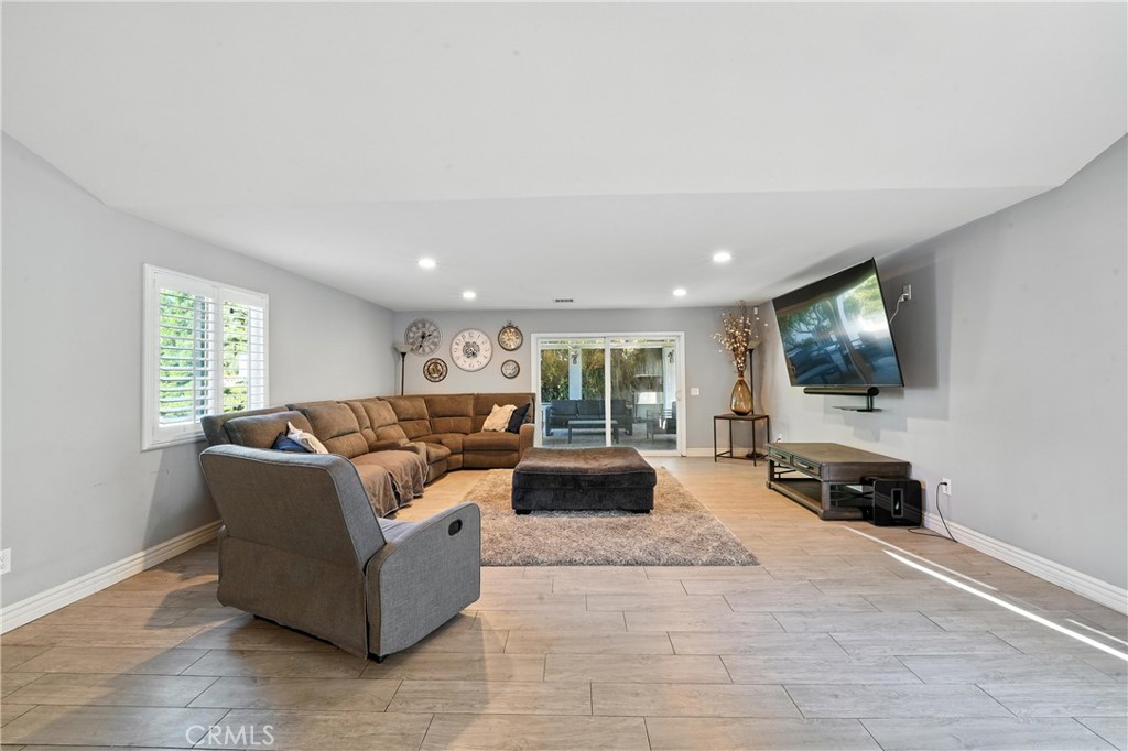 1817 Balboa Way Upland, CA 91784 - Photo 24 of 64 a living room with furniture and a flat screen tv