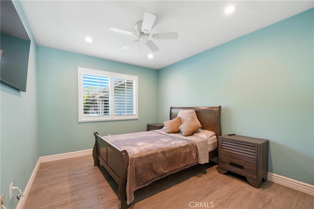 1817 Balboa Way Upland, CA 91784 - Photo 32 of 64 a bedroom with a bed and a chandelier