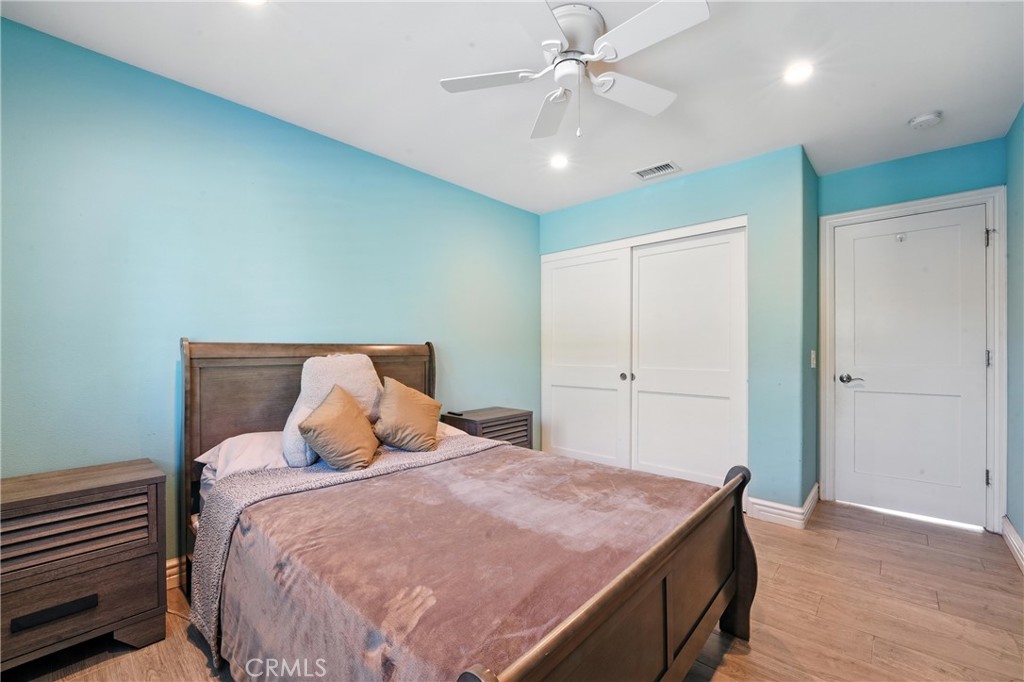 1817 Balboa Way Upland, CA 91784 - Photo 33 of 64 a bedroom with a bed and a chandelier