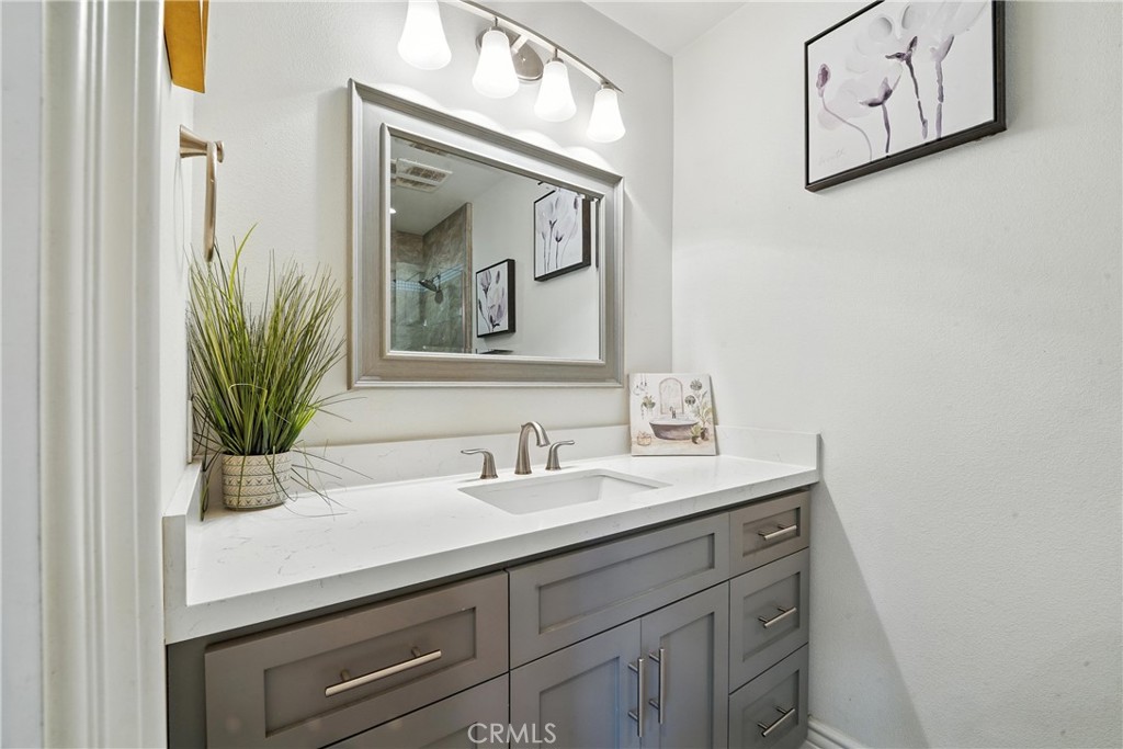 1817 Balboa Way Upland, CA 91784 - Photo 35 of 64 a bathroom with a sink and a mirror