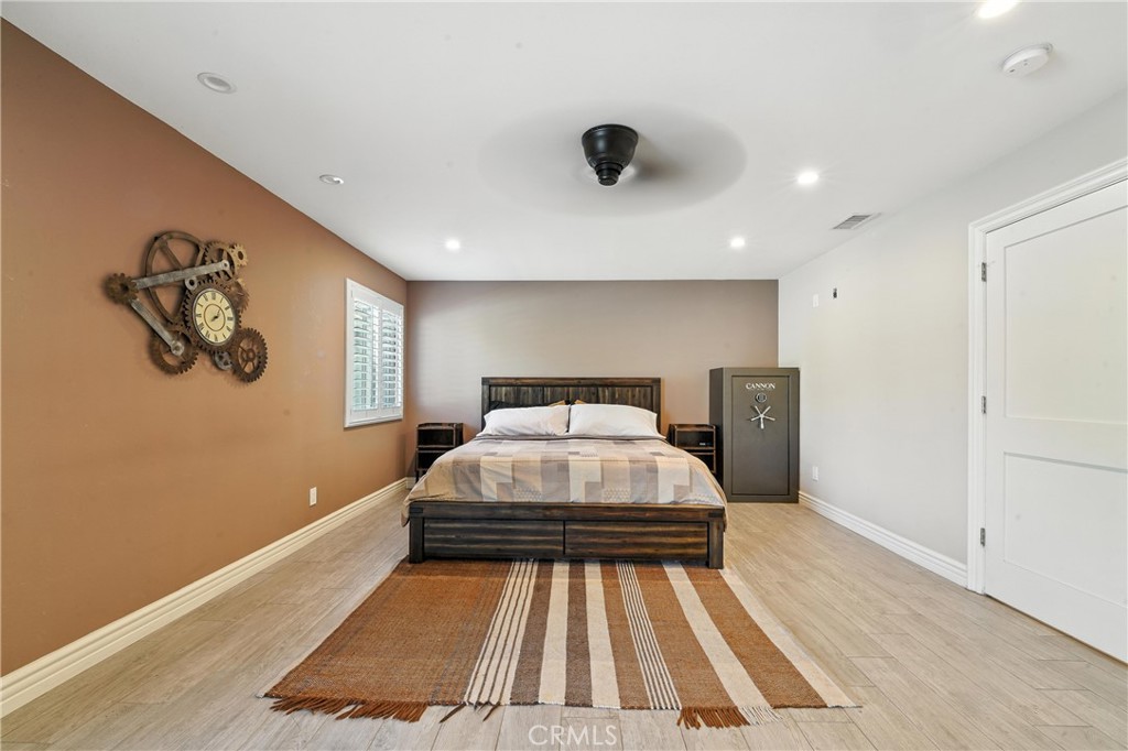 1817 Balboa Way Upland, CA 91784 - Photo 40 of 64 a bedroom with a bed and painting on the wall