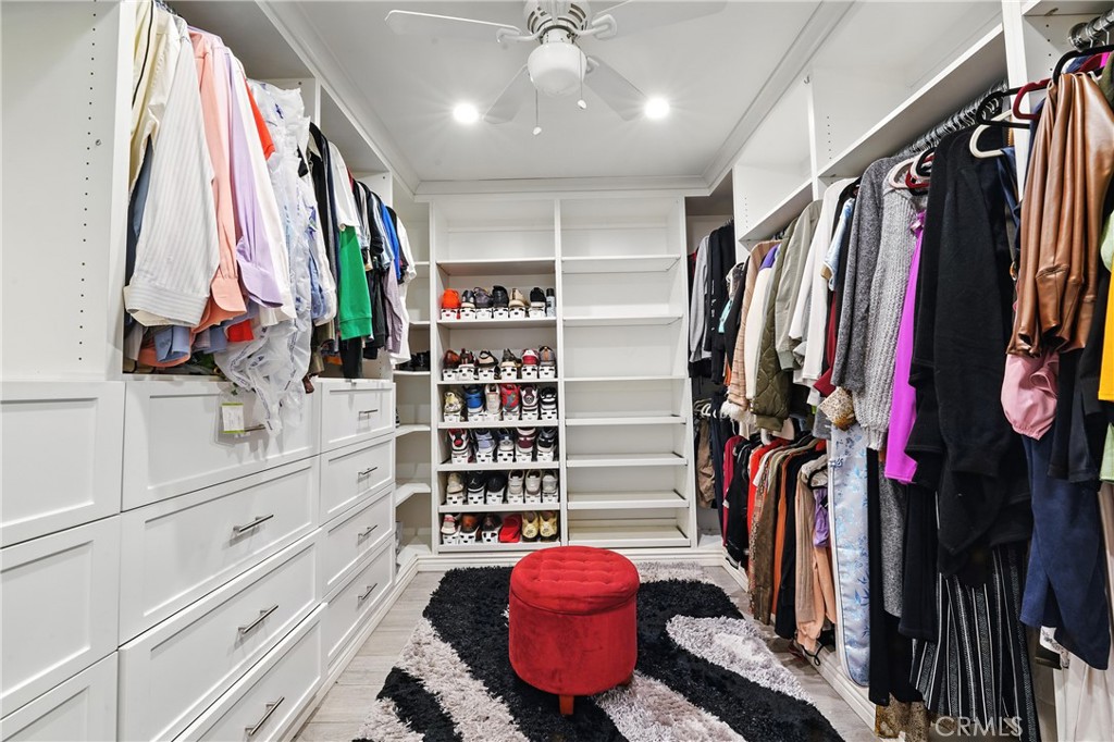 1817 Balboa Way Upland, CA 91784 - Photo 43 of 64 a view of walk in closet with clothes and shoes