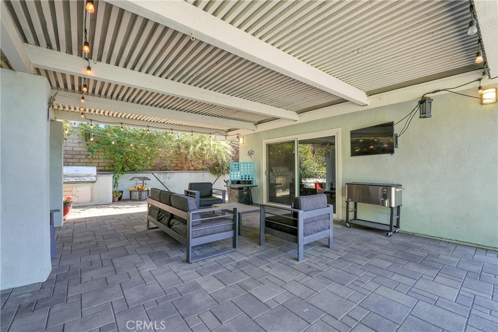 1817 Balboa Way Upland, CA 91784 - Photo 51 of 64 a view of a patio with table and chairs with wooden floor and fence