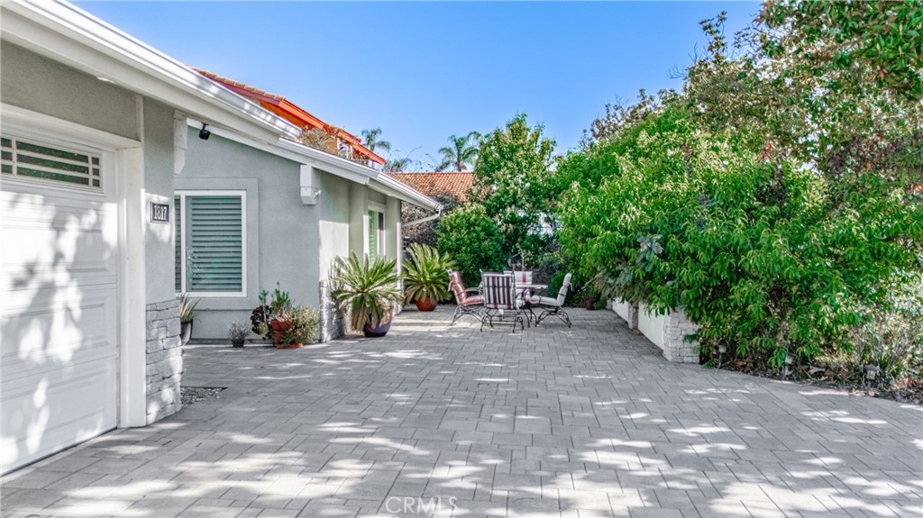 1817 Balboa Way Upland, CA 91784 - Photo 6 of 64 a view of backyard with a table and chairs and potted plants