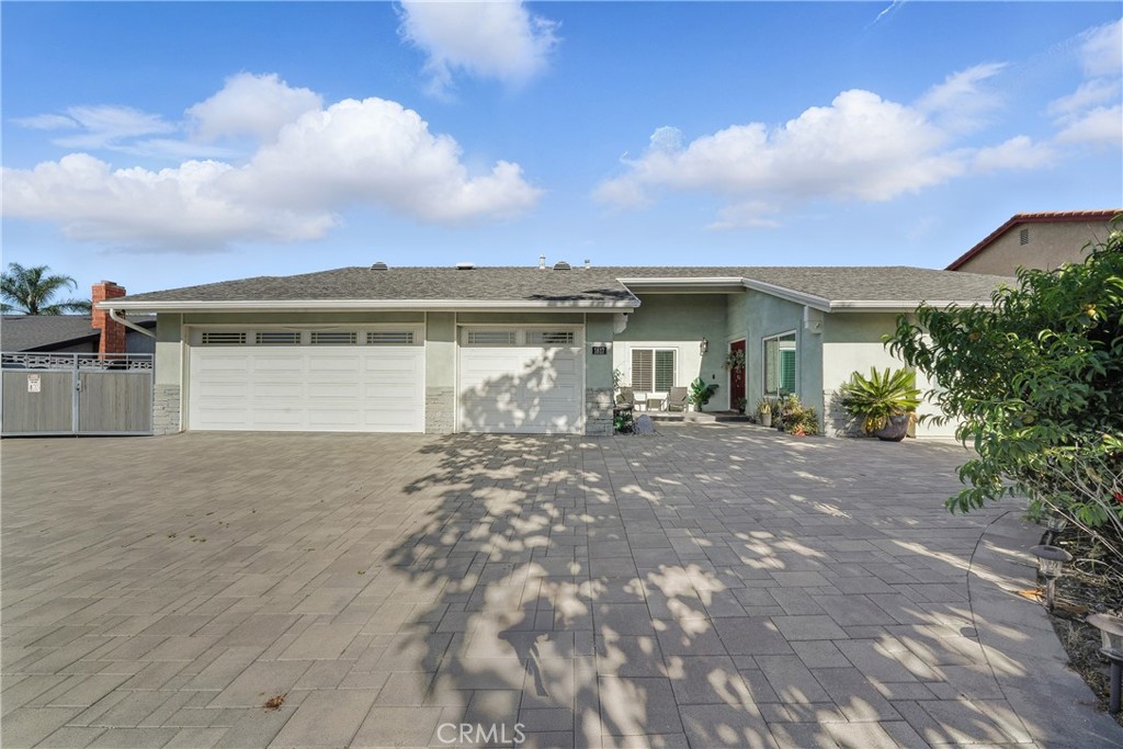1817 Balboa Way Upland, CA 91784 - Photo 8 of 64 a view of a house with a yard and garage