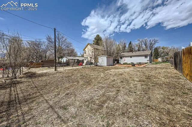 a view of a dry yard with sitting area