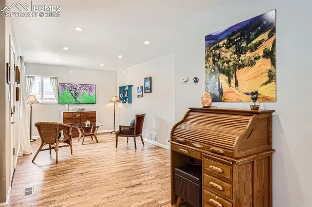 a view of a dining room with furniture window and wooden floor