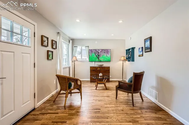 a living room with furniture and a table
