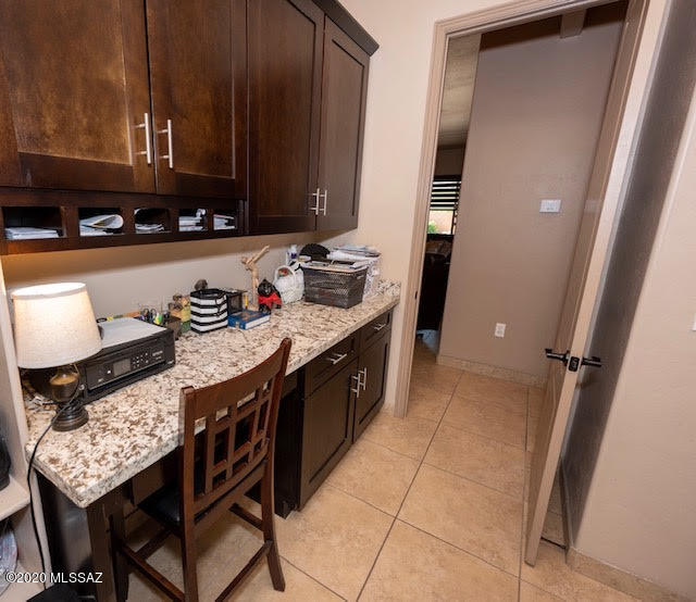 407 Camino Agua Fria Rio Rico, AZ 85648 - Photo 31 of 41 a kitchen with stainless steel appliances granite countertop a stove a sink and a microwave