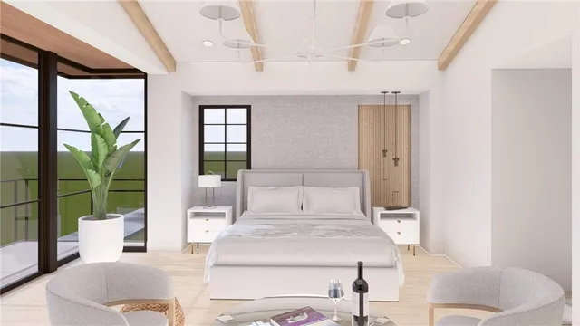 a living room with a large window and furniture