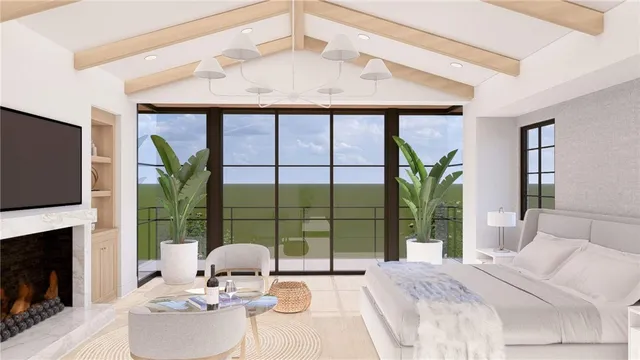 a living room with a large window and furniture