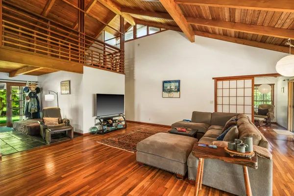a bed room with a bed and a chair