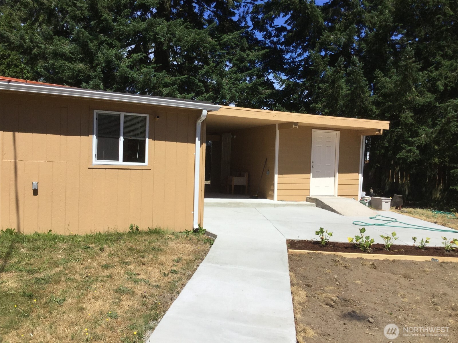 801 Pecks Drive, Unit B Everett, WA 98203 - Photo 1 of 1 a front view of a house with trees