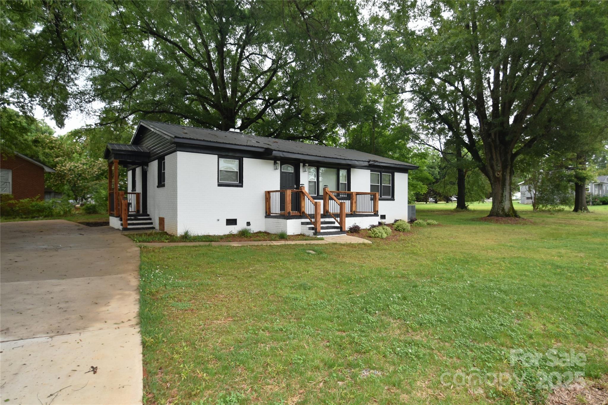 706 McIntyre Street Monroe, NC 28110 - Photo 2 of 20 a front view of house with yard and green space